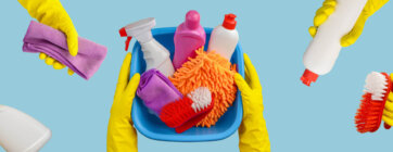 Hands,In,Rubber,Gloves,Hold,A,Basin,With,Cleaning,Supplies
